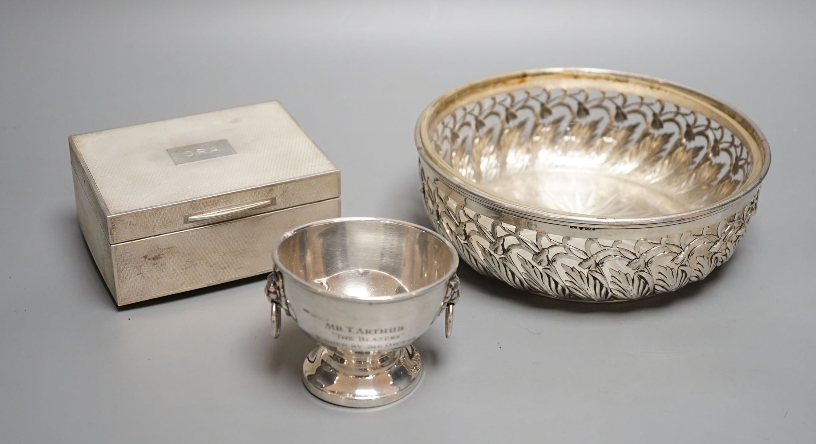 A Swedish white metal mounted glass circular bowel, diameter 18.1cm, a silver mounted cigarette box and a small silver presentation bowl.